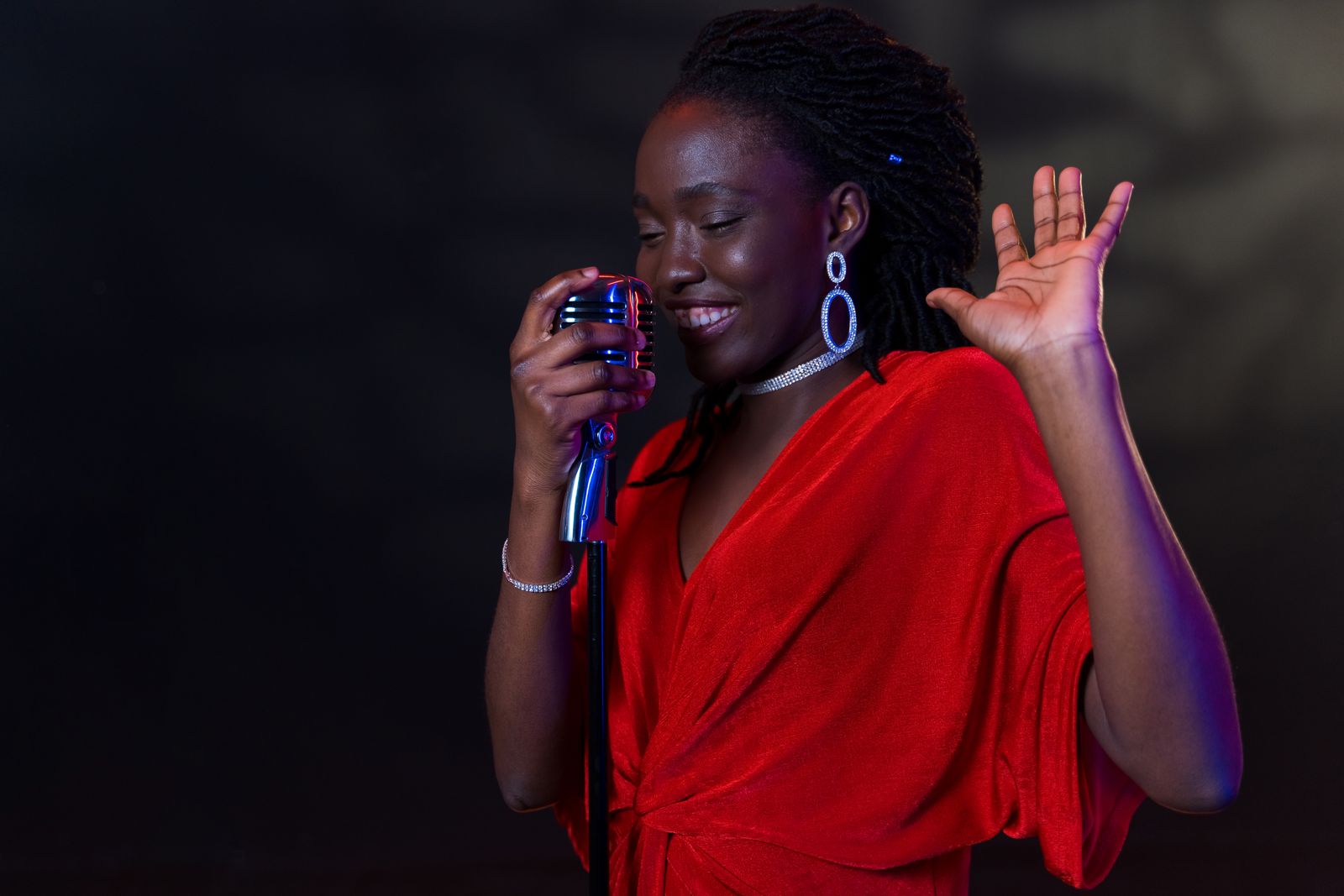 A vocalist performing with a vintage microphone